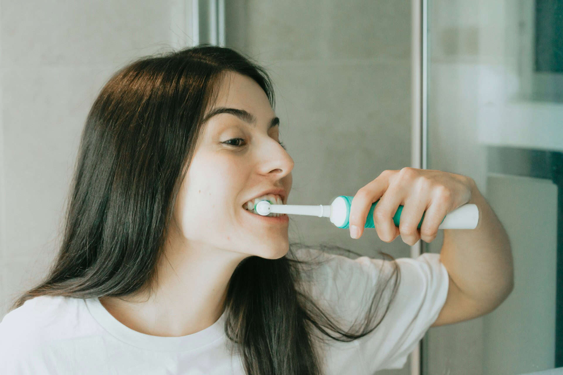 woman brushing teeth